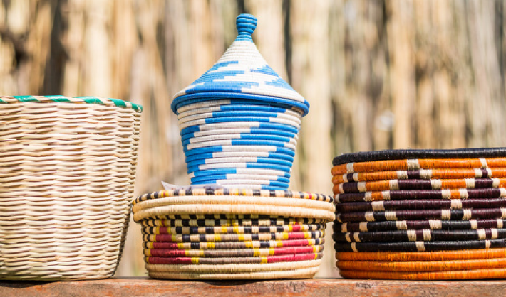 A variety of colorful woven baskets with different patterns.