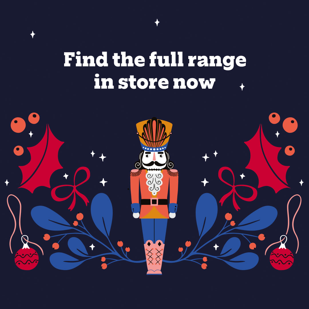 "A festive graphic featuring a colorful nutcracker illustration surrounded by holiday decorations like holly leaves, ornaments, and ribbons. The text above reads, ""Find the full range in store now."" "